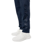 Blue Bauer pants and white shoes on a white background
