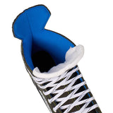 Close-up of a sneaker with blue lining and white laces on a white background