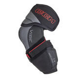 A CCM Vibe 1.6 hockey elbow pad in black and gray with red accents, shown on a plain white background.