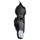 A black and white hockey shin guard shown from the side against a plain white background.