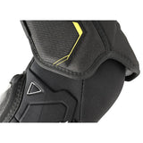 Black protective elbow pad with brand logos on a white background