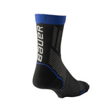 Back of a Bauer black and blue sock on a white background