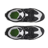 Black and white sneakers with green accents on a white background