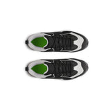 Top-down view of a black, white, and green sneaker on a white background