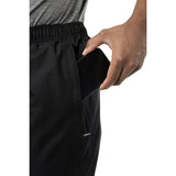 Hand holding a pocket of a black pant on a white background