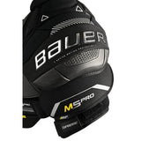 Bauer M5 Pro shoulder armor in black and dark gray with white and yellow accents, displayed on a clean white background.