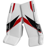Pair of Warrior brand hockey goalie leg pads on a white background