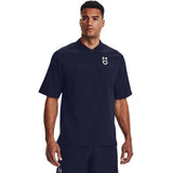 Man wearing a navy Under Armour shirt on a white background