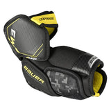 Black and yellow Bauer elbow pad on a white background