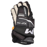 A single CCM XF Pro hockey glove in black and white, featuring a black wrist cuff, white logo, and off-white finger padding, shown against a plain white background.