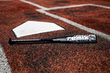 Baseball bat with 'Remix' branding on a baseball field