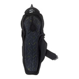 Black hockey shin guard with a dark gray patterned inner panel and small yellow accents, shown from the back on a white background.