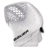 A white Bauer hockey goalie glove with black 'BAUER' branding on the palm, featuring a white mesh pocket and white laces, shown against a plain white background.