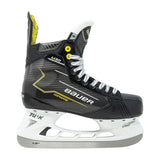 A single Bauer hockey skate boot in black with yellow and white accents, featuring a white blade and silver laces, shown against a plain white background.