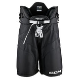 Black CCM hockey pants with white laces and white CCM branding on the lower leg, shown against a plain white background.