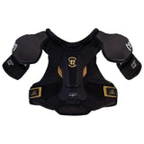 Black hockey shoulder pads with gold accents and white logo details, shown against a plain white background.