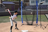 Child practicing batting in a batting cage with a Louisville Slugger cage and ball machine.