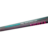 A close-up of a CCM Ribcor Platinum hockey stick shaft showing the black and teal carbon fiber weave pattern with pink and white branding details.