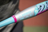 Close-up of a baseball bat barrel with a metallic silver finish, light blue section, pink ring, and colorful graphic details. The brand name 'WORTH' is clearly visible on the barrel.