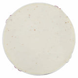 Round white object with specks on a white background