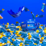 Blue Jolly Rancher candy packaging with a blue mouthguard on a blue background