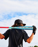 a man with a teal and red bat on his shoulders with the word Atlas on it