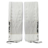 A pair of white hockey shin guards with 'TRUE 7X' branding, displayed side-by-side against a plain white background.