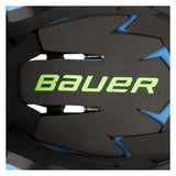 Close-up of a Bauer hockey helmet shell showing the black foam face protector with a bright green Bauer logo and blue accent lines.