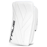 A white hockey goalie pad with black 'TRUE' branding on the side, shown against a plain white background.