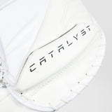 Close-up of a white leather baseball glove with the brand name 'CATALYST' printed in black on the palm pocket.