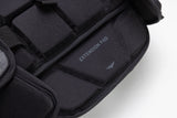 Black extension pad with visible branding on a white background