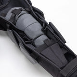 Black and gray tactical backpack with multiple compartments on a white background