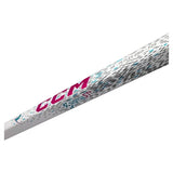 A close-up diagonal view of a CCM ST2 golf shaft grip, showing the white textured surface with magenta CCM branding, blue accents, and black dotted graphics.