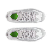White sneakers with green accents on a white background