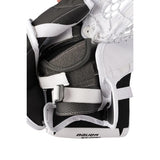 A white Bauer hockey goalie glove with black and white branding, shown on a solid white background.