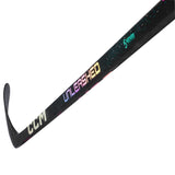 A close-up diagonal shot of a CCM hockey stick on a solid white background, showing the 'Unleashed' model name in a gradient of colors and the 'CCM' brand logo on the blade.