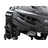 Close-up of a black hockey helmet with 'Bauer' branding on a white background