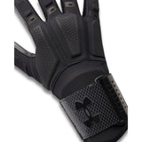 Black glove with textured palm and Under Armour logo on a white background